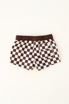 backside of Trendy checkered swim shorts with an elastic waistband and drawstring, made from quick-drying fabric. Ideal for swimming, beach trips, and outdoor activities. Features vibrant patterns and a comfortable fit for active kids.