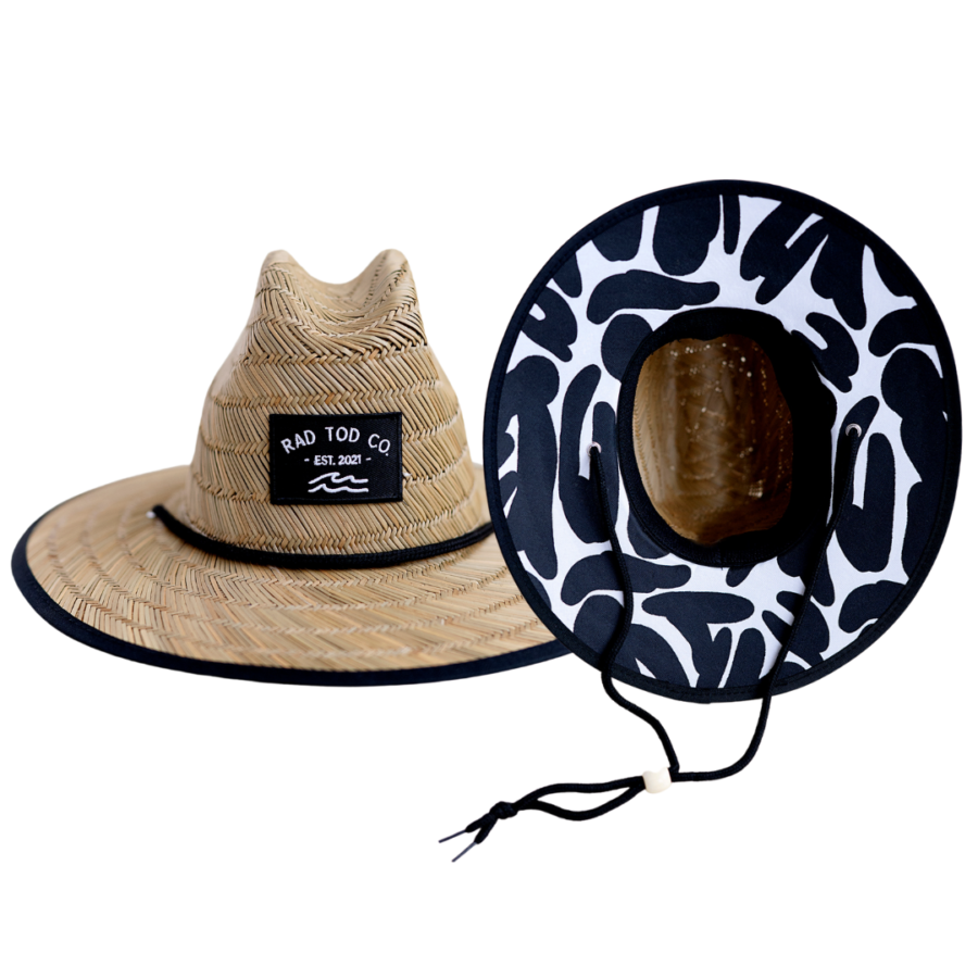 a black and white color straw hat by Rad Toddler. Looks great for sun protection