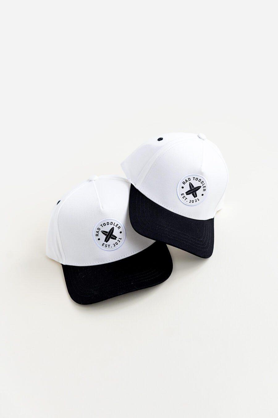 A black and white snapback by rad toddler. Comes in different sizes and looks very stylish
