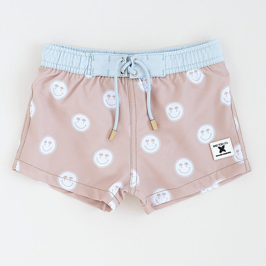 Stylish above the knee swim trunks for kids, toddlers, babies in a tan and blue smiley pattern