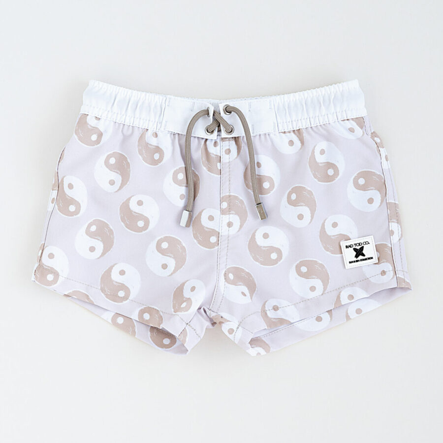 Stylish above the knee swim trunks for kids, toddlers, babies in a beige yin yang pattern