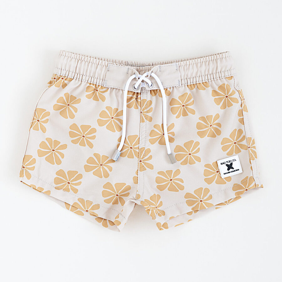 Stylish above the knee swim trunks for kids, toddlers, babies in a floral yellow pattern