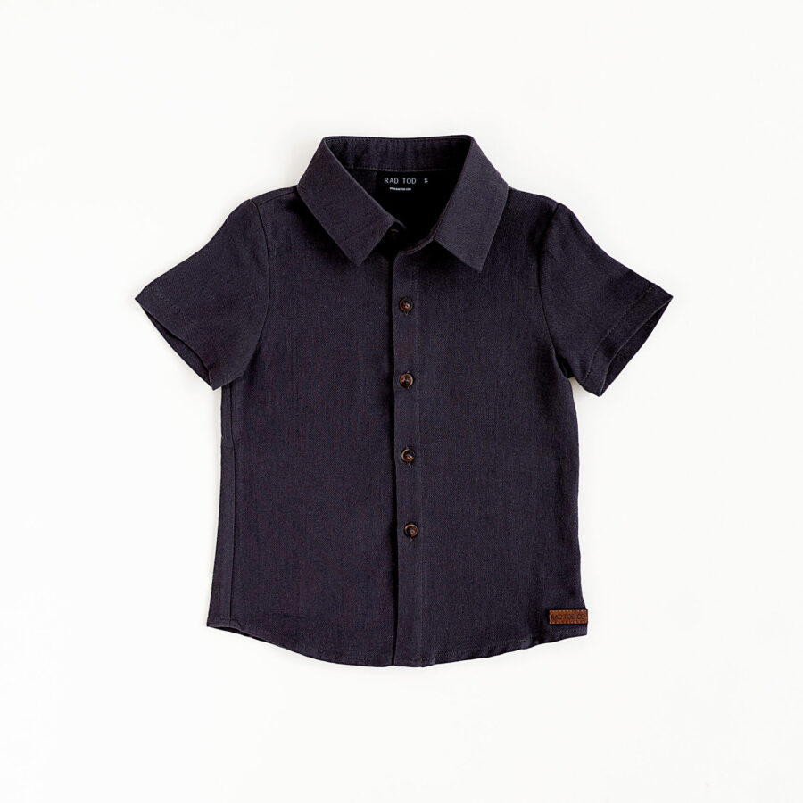 Charcoal colored button up shirt for kids. Looks stylish and has a leather patch at the bottom of the shirt
